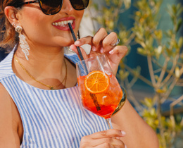 Guest enjoying Aperol Spritz